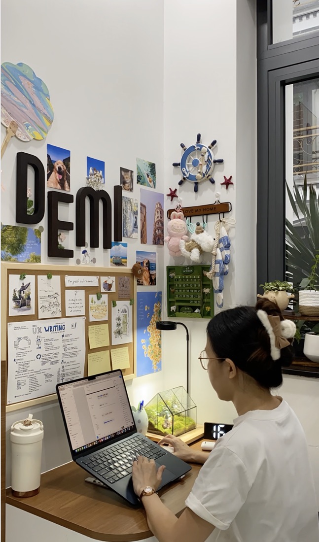Demi writing at her desk